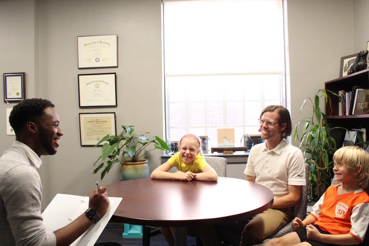 A student training to be a social worker interviews a family at the School of Applied Sciences with the University of Mississippi