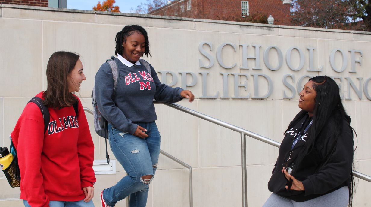 School of Applied Science - Diverse students chatting outside the School of Applied Science building. 